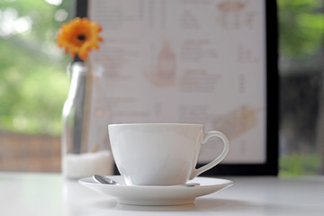 white empty coffee cup and spoon