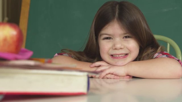portrait of smiling girl in classroom