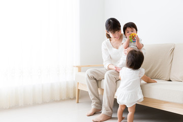 asian family relaxing in the living room