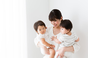 asian family relaxing in the living room