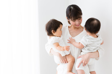 asian family relaxing in the living room