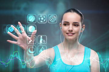 Young girl in sports concept pressing virtual buttons