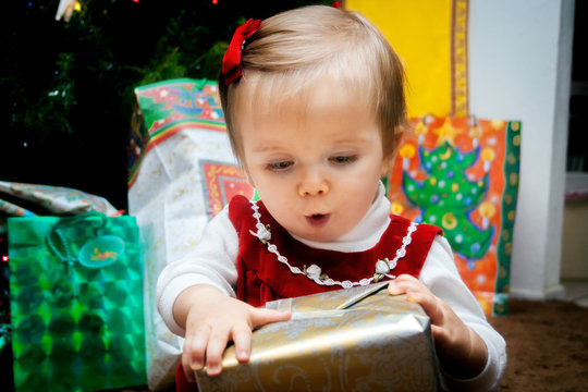 Baby Fascinated With Christmas Present