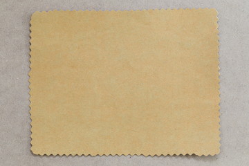 vintage of cardboard on brown background and copy specs.
