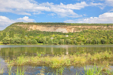 green hill and lake