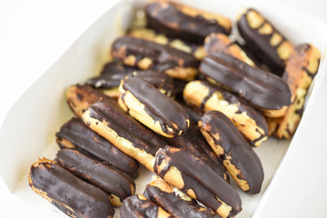chocolate eclairs on white box