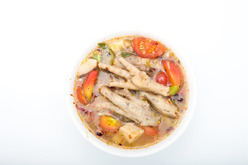 Chicken feet in a bowl with spicy soup