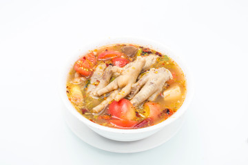 Chicken feet in a bowl with spicy soup