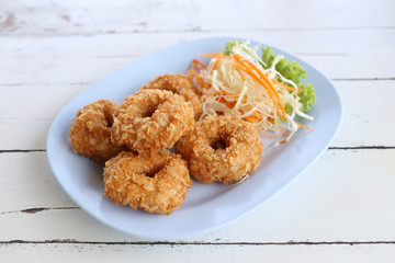 Fried Prawn Cake (tod mun kung) in blue dish.