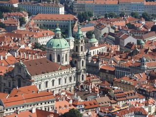 Fototapeta na wymiar Prague is the capital of the Czech Republic. political and cultural center of Bohemia. Its historic center was included in the Unesco World Heritage . Roofs of the city.