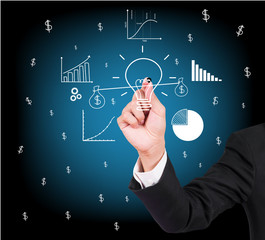 Businessman hand writing and drawing light bulb, idea concept