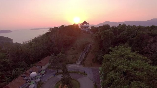 aerial photography on khao khad view point Phuket
sunset at Khao Khad view point the sun going down to the roof view point building Khao Khad view point can  see around Phuket island 360 degree
