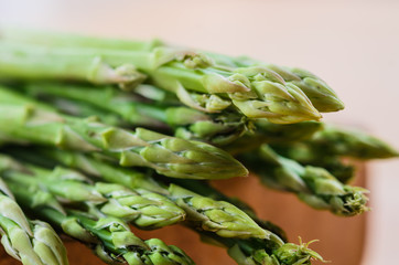 Bunch of fresh green asparagus spears on  table