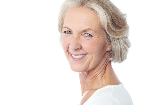 Attractive aged woman posing to camera.