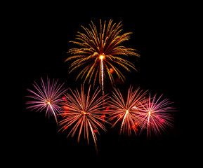 Colorful fireworks of various colors over night sky  - Vibrant c