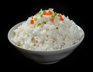 Bowl of organic white rice isolated on a black background