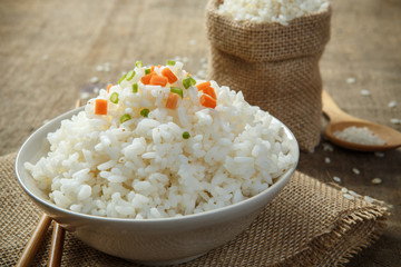 Jasmine rice with chopsticks on a burlap