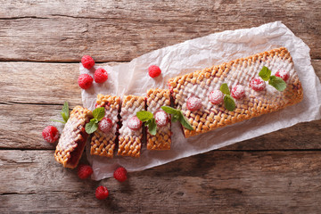 Sliced raspberry pie close-up on the table. horizontal top view

