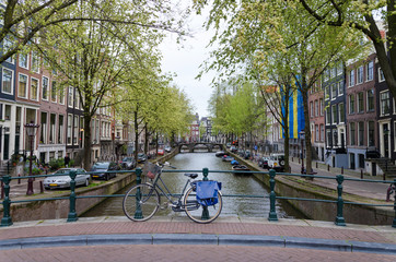 Bicycle lining a bridge over the canals of Amsterdam © siraanamwong