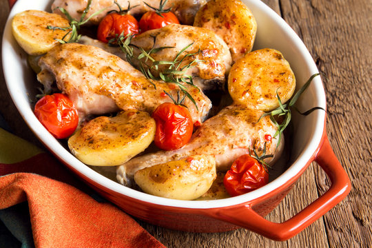 Oven baked chicken legs with vegetables