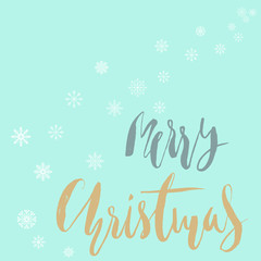 Merry Christmas gold and white lettering design on blue background with white snowflakes.
