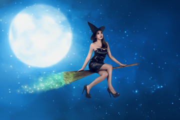 Obraz na płótnie Canvas Asian witch woman ride the broom on the sky