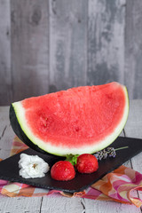 Fresh watermelon on the wooden table, selective focus