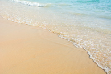 Fototapeta na wymiar Sand and blue sea