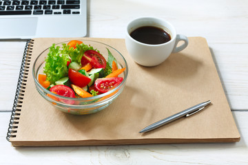 Healthy business lunch snack in office, vegetable salad and coffee