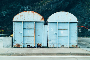 Rusty old storages in the street