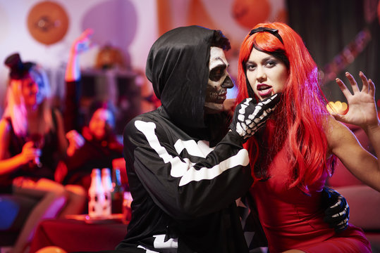 Sensual couple at halloween party