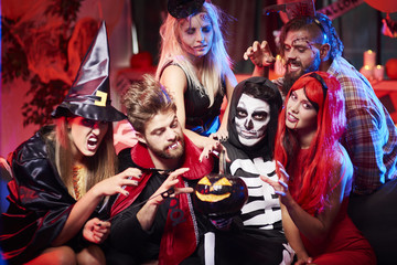 Creepy pumpkin and spooky costumes