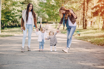 young family walking in the park