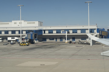 Fototapeta na wymiar Athens, Greece - August 15 2016: Athens airport loading bridge at main terminal. Athens International Airport Eleftherios Venizelos passenger boarding bridge (PBB) at Area B.