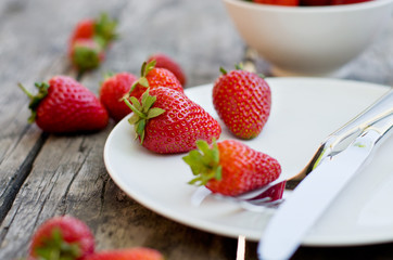 Ripe red strawberries on wooden table