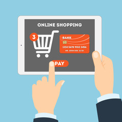 Online shopping concept. Buying products and service through Internet. Shopping cart with pay button.