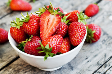 Ripe red strawberries on wooden table