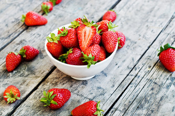 Ripe red strawberries on wooden table