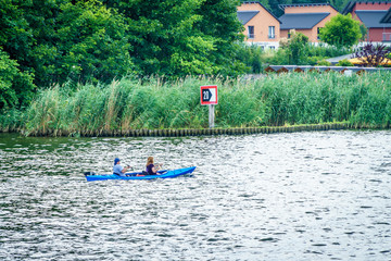 Two people practicing canoeing