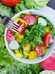 Vegetable salad in a white cup