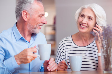 Smiling senior couple resting in the cafe