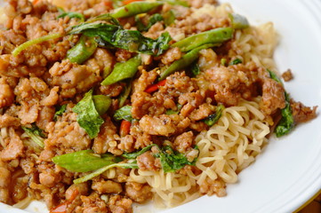 instant noodle topping spicy stir fried minced pork and basil leaf on dish