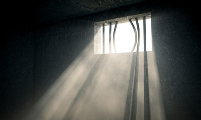 jail window bent bars dark background, light enters. freedom concept