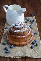 Cinnamon bun with blueberries