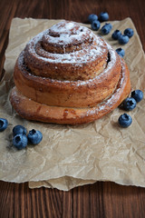 Cinnamon bun with blueberries