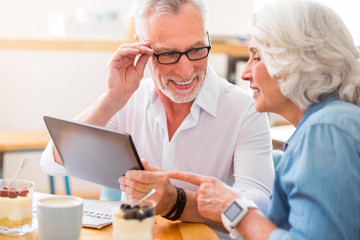Cheerful senior couple resting together