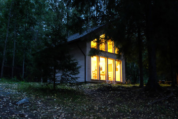 Fototapeta na wymiar country house in night forest