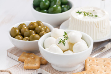 soft cheeses, crackers and pickles, horizontal
