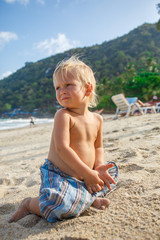 Portrait of little toddler on a beach