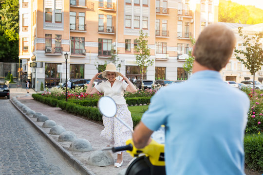 Smiling Woman In The Street. Man On A Scooter. We Spent Vacation In Europe. Time To Move On.